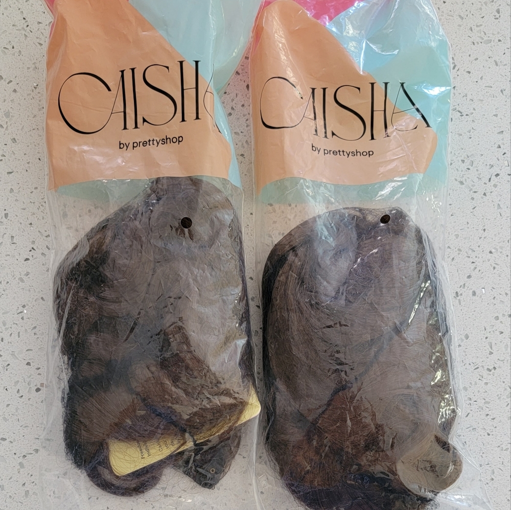 New clip in extensions. Two packs.  22" long. Brunette